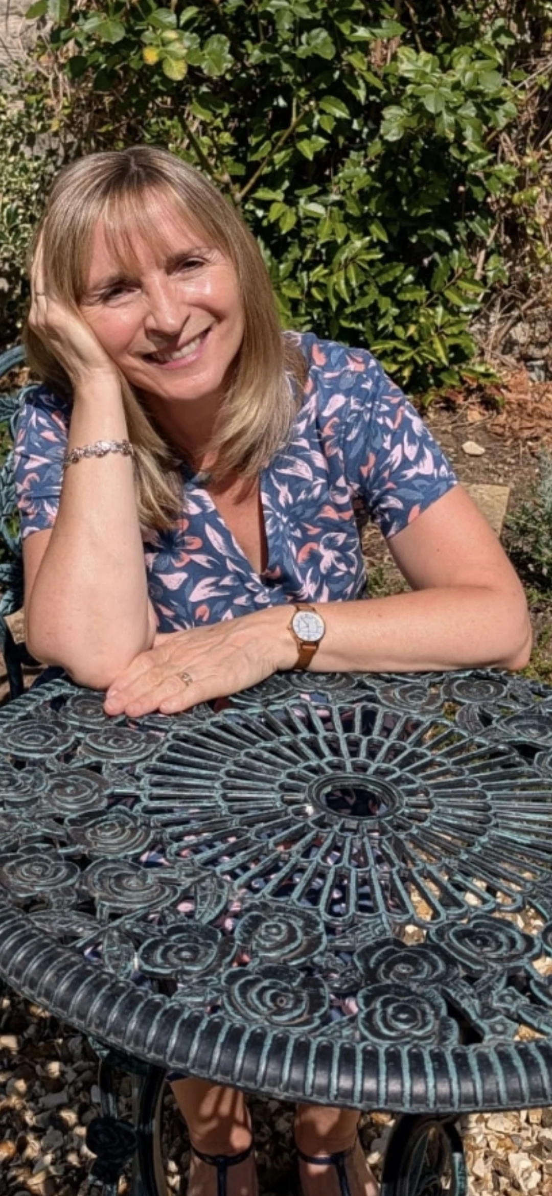 Jo Jones smiling at a garden table